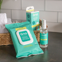 ona Renewals Antimicrobial Perineal Spray lifestyle image featuring it alongside the ona Renewals Perineal Pad Liners elegant bathroom setting for postpartum wellness